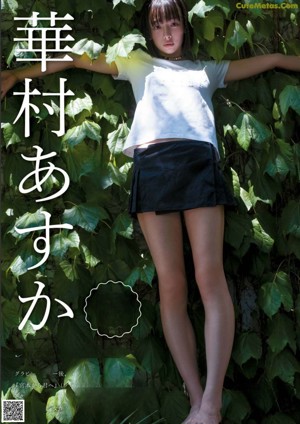 A woman laying on top of a wooden chair.