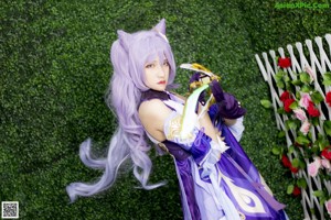 A woman with long blue hair holding a sword.