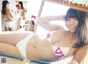A woman in a white bikini posing for the camera.
