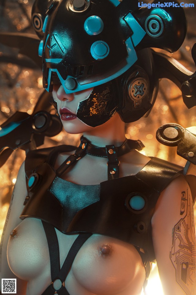 A woman in a futuristic outfit with a helmet on.