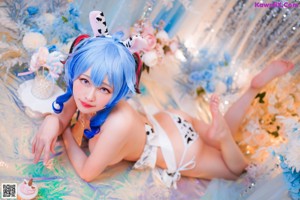 A woman in a bunny costume is posing for a picture.