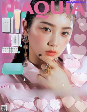 A woman in a pink shirt is posing for a magazine.