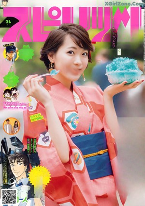 A woman in a red kimono standing in front of blue flowers.